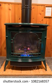 Bedroom Heating From A Propane Fireplace Made To Look Like An Antique Wood Stove.