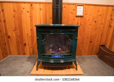 Bedroom Heating From A Propane Fireplace Made To Look Like An Antique Wood Stove.