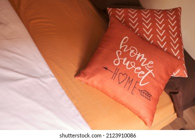 Bedroom And Home Sweet Home Message On Orange Cushion