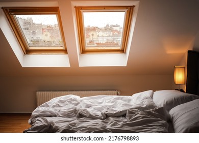 bedroom interior in scandinavian style with skylights - Shutterstock ID 2176798893