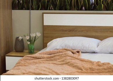 Bedroom Interior, Tulip Bouquet On Night Stand.