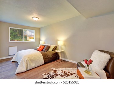 Bedroom Interior In White And Brown Color Combination, Cow Hide Rug On The Floor. Northwest, USA