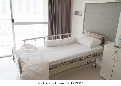 Bedroom for patient in a hospital.  White cream room design. Brown curtain.