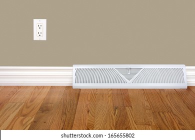 Bedroom Wall With Heating Register, Electrical Outlet And Hardwood Floor