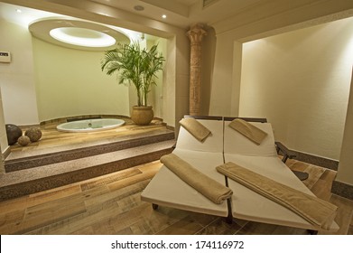 Beds and jacuzzi in a private VIP area of luxury health spa