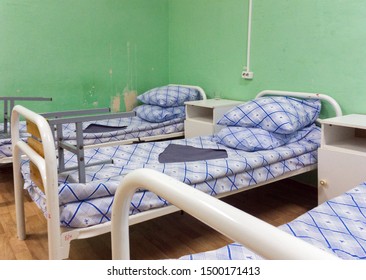 Beds in a regular ward of a budget medical institution - Shutterstock ID 1500171413