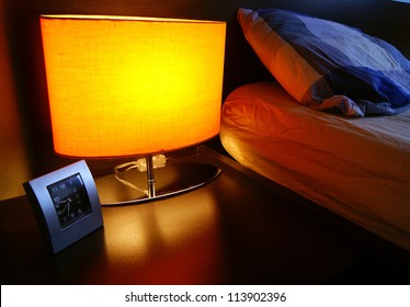 Bedside Table With Lamp, And Clock