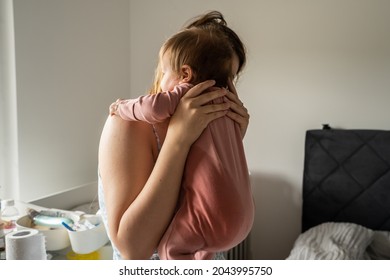 Bedwetting Child Pee Stain On The Side Of The Clothes Of Baby Mother Hold Her Infant Child With Wet Clothes