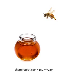 Bee Flying To Honey Glass Isolated On A White Background