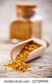 Bee Pollen Granules In Wooden Scoop