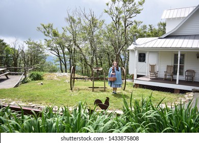 Beech Mountain, NC /USA/June 13, 2019/Land Of Oz, Dorothy Standing In Front Of The Gale's Family Farm House