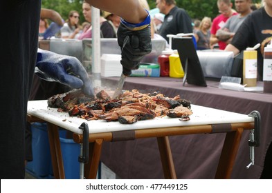 Beef Being Sliced At An Outdoor Food Truck Festival