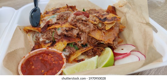 Beef Birria Quesadilla At A Mexican Restaurant.