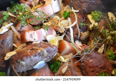 Beef Bourguignon Recipe: After Browning The Pieces Of Beef, Smoked Pork Belly And Onions In Butter, Add The Garlic, Thyme And Parsley.