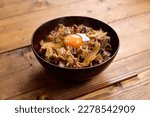 Beef bowl with raw egg on top