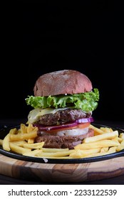 beef burger sandwich with french fries salad and cheese - Shutterstock ID 2233122539
