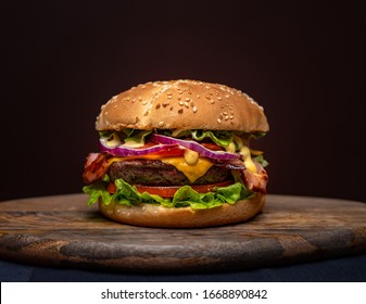 Beef burgers on wooden plate
