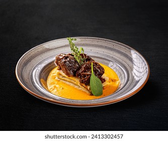 Beef cheeks and crepes with green spices, huntersâ€™ stew and beef jus