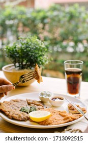 beef and chicken schnitzel on the same plate