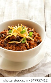 Beef Chili  / Bowl Of Beef Chili With Cheddar Cheese On Top