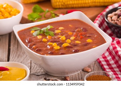 Beef Chili With Corncobs On White Bowl.