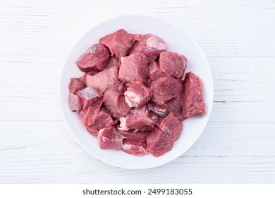 Beef cubes . Photography of raw cutting meat . Top view
 - Powered by Shutterstock