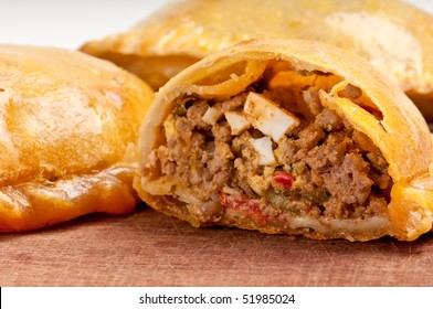Beef Empanada fill close up.  The Empanada is a pastry turnover filled with a variety of savory ingredients and baked or fried. - Shutterstock ID 51985024