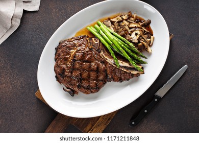 Beef Eye Of A Round Steak With Asparagus And Mushrooms