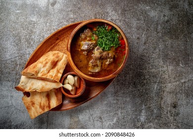 Beef Goulage With Garlic And Pita Bread On A Gray Stone Table, Flatlay