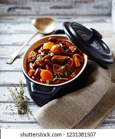 Beef goulash with mushrooms and vegetables. Symbolic image. Concept for a tasty and hearty dish. Bright wooden background
 - Shutterstock ID 1231381507