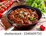 Beef goulash, soup and a stew, made of beef chuck steak plenty of paprika. Hungarian traditional meal. Beef stew - goulash
