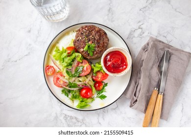 Beef Hamburger With Lettuce Tomato Salad On White Plate, Top View.