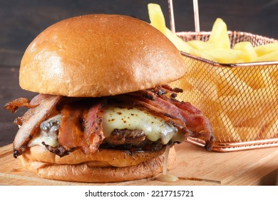 beef hamburger sandwich with brioche bun cheese and french fries. - Powered by Shutterstock