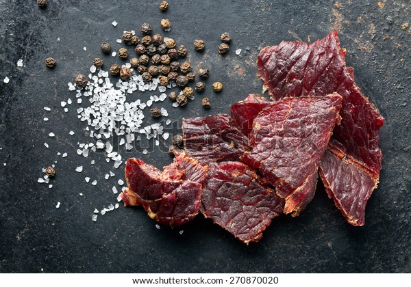 beef jerky and spice on old
table
