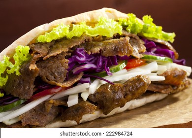 Beef Kebab In A Bun On Woodboard