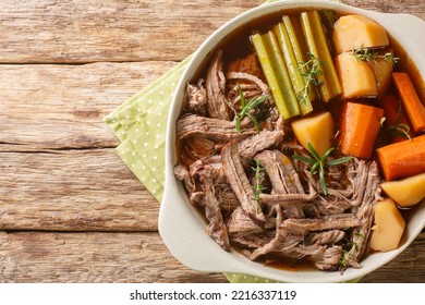 Beef Meat And Vegetables Stew Homemade Slow Cooker Pot Roast With Carrots, Celery And Potatoes Close Up In The Bowl On The Wooden Table. Horizontal Top View From Above
