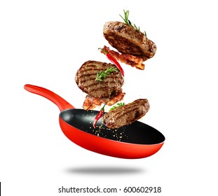 Beef milled meat flying from a pan, isolated on white background