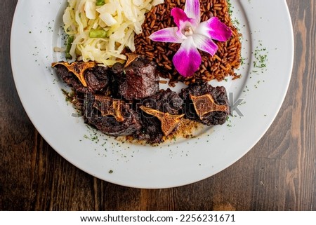 Beef. Oxtails. Beef shank. Braised beef. Angus beef steaks. Tenderloin, filet mignon, New York strip, rib-eye grilled on outdoor wood-fired grill. Classic American steakhouse entree favorite.