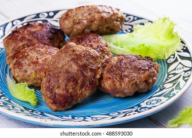 Beef And Pork Sausage Patties In Blue Plate