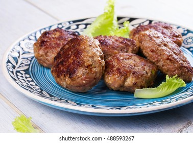 Beef And Pork Sausage Patties In Blue Plate