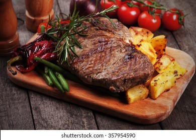 Beef rib-eye steak with roasted potato and vegetables