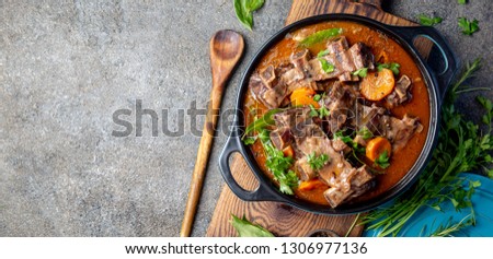 Beef ribs Bourguignon. Beef ribs stewed with carrot, onion in red wine. France dish