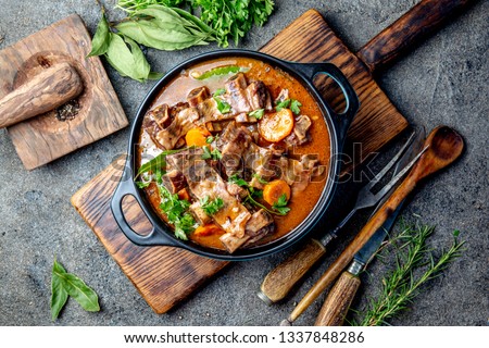 Beef ribs Bourguignon. Beef ribs stewed with carrot, onion in red wine. France dish
