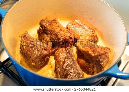 Beef ribs seared in the pan.