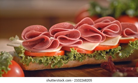 Beef Salami Sandwich Served At The Dinner Table. Ham, Cheese And Lettuce Sandwich. Turkey Sandwich With Tomatoes And Lettuce. 