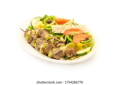 Beef Shish Kabobs With Greek Salad On Side Served On A Plate Isolated On White Background