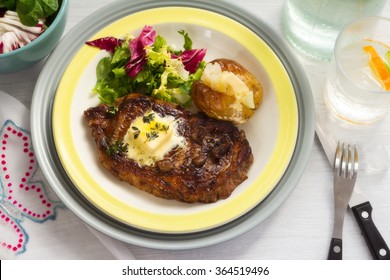 Beef Steak With Baked Potato And Salad