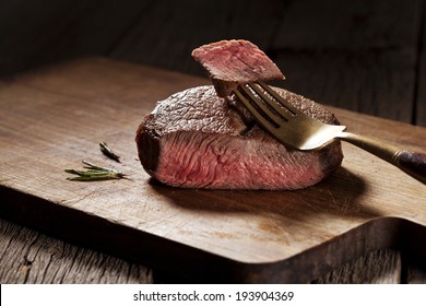 Beef Steak Cooked To Medium Rare On Wooden Background