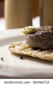 Beef Steak Fillet on Toasted Baguette Bread with Melting Butter and Herbs