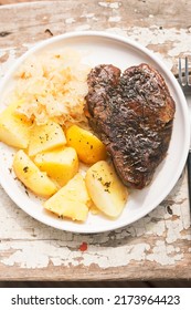 Beef Steak With Fried Potatoes And Cabbage And Carrot Slaw